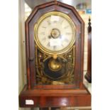 A late 19th century, mahogany cased mantle clock, painted dial, glass door with painted