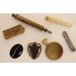 A Jockey Club Souquet L. Le Grand Paris; an ivory cigarette holder; a gilt metal vesta case;