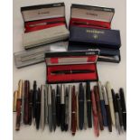 A large collection of mid 20th Century fountain pens and ball point pens, some boxed