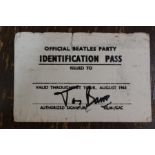 An Official Beatles Party Identification Pass, August 1965, signed in black pen.