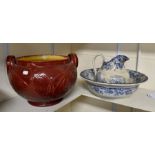 A 19th Century wash bowl and water jug, blue and white; together with an Art Nouveau red ground