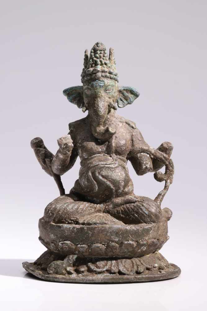 GaneshaBronze,India, Post-Gupta 8th centuryH: 14 cmA four-armed Ganesha in lotus pose sitting on a