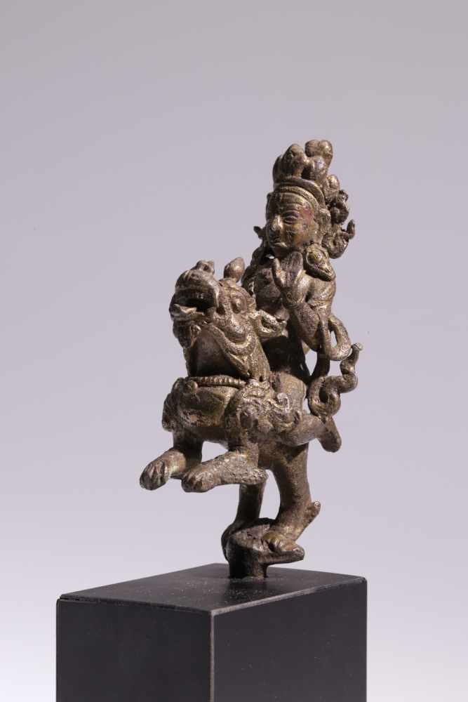 Bodhisattva on LionBronze,Nepal, 18th century,H: 10 cmBodhisattva riding on lion, forming abhaya