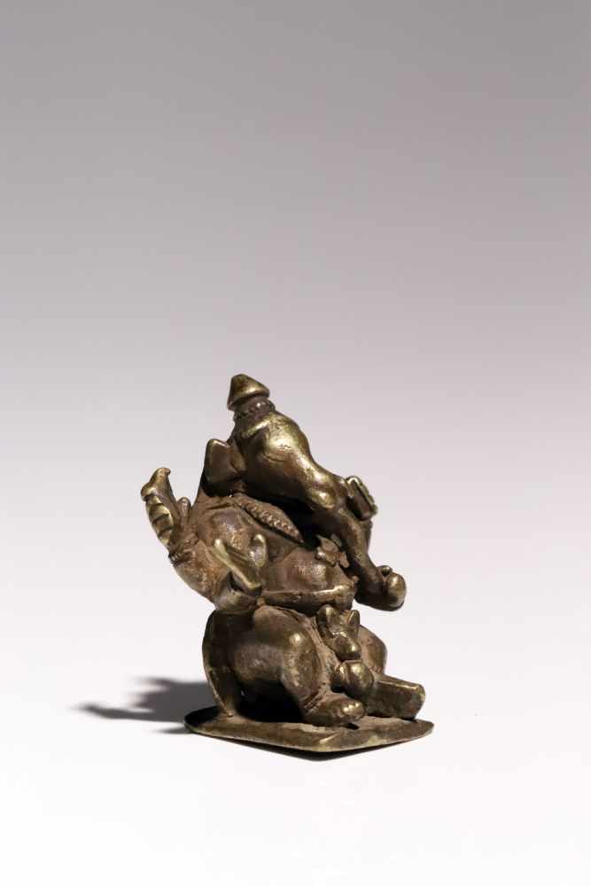 Ganesha on NandiBronzeIndia17th ctH: 6 cmGanesha riding on white bull Nandi. In his two raised hands - Image 2 of 5