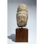 Head of GuanjinStoneChina12th ctH: 30 cmThis beautifully modeled head of a Guanyin shows the