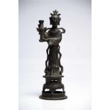 Woman with VaseBronzeChina16th ctH: 29 cmA noble lady standing on a round platform in a long robe, a