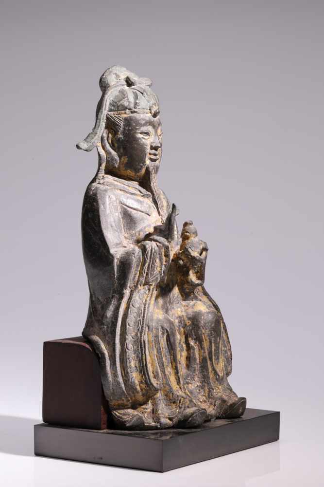 Daoist TeacherBronze,China, 18th century,H: 25 cmA sitting Daoist in long robes and with - Image 2 of 2