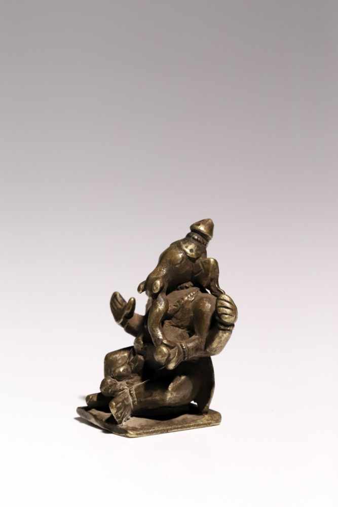 Ganesha on NandiBronzeIndia17th ctH: 6 cmGanesha riding on white bull Nandi. In his two raised hands - Image 3 of 5