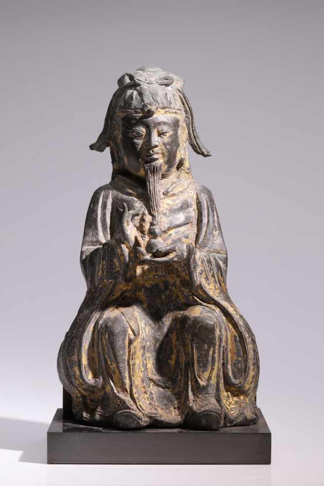 Daoist TeacherBronze,China, 18th century,H: 25 cmA sitting Daoist in long robes and with