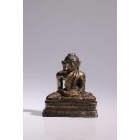 BuddhaBronze rest gilt,Sri Langka, 14th centuryH: 7 cmSeated Buddha in meditation posture on lotus