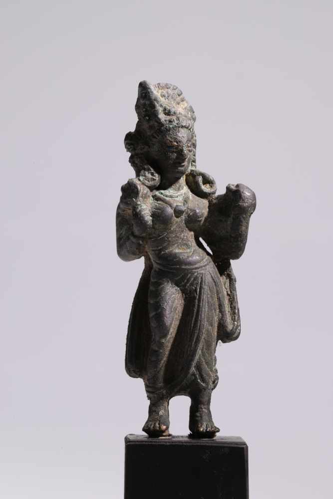 TaraBronze with Silver Eyes,Swat Valley, 7th to 9th centuryH: 10 cmStanding Tara with a lotus flower