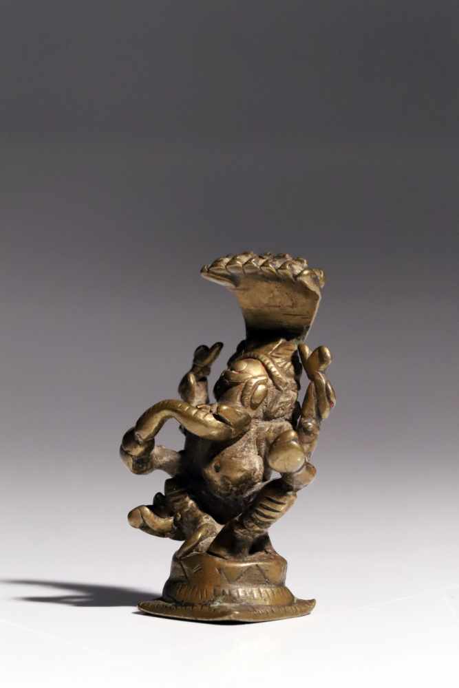 GaneshaBronzeIndia17th ctH: 7 cmA four-armed Ganesha god sitting wide-legged on a conic base. He - Image 3 of 5