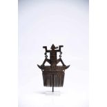 Hair CombHornIndonesia19th ctH: 13 cmDelicately engraved hair comb. A human-like figure is sitting