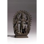 VishnuBronzeIndia18th ctH: 11 cmA four-armed Vishnu before an aureola and holding attributes: a
