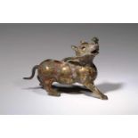 AUSPICIOUS ANIMAL IN FORM OF A DOGbronze,China, Han Dynasty,Size: 13,2 cm x 9 cmThe Han Emperor Ling