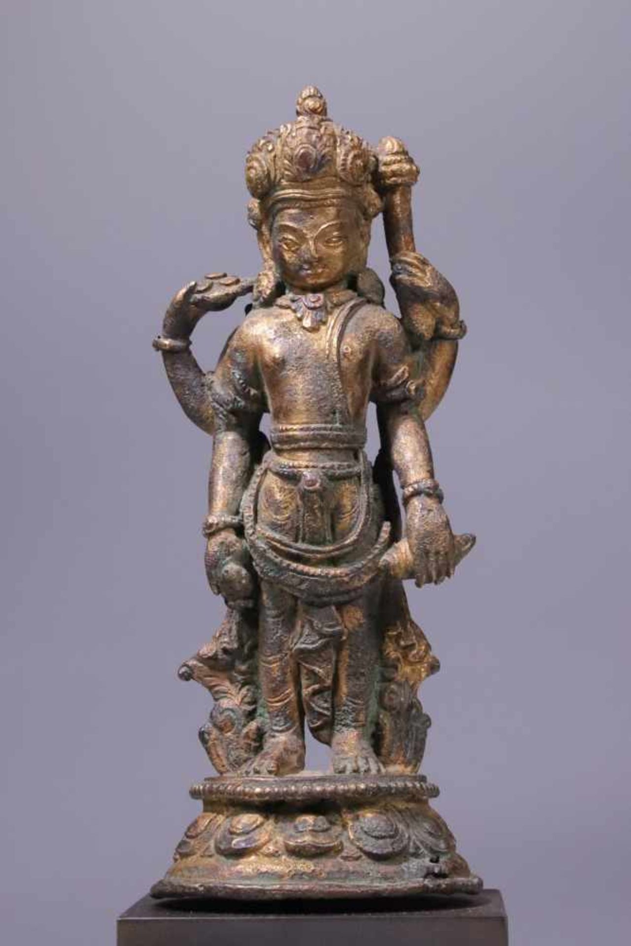 VISHNUbronze gilt,Nepal , 12th century,Size: 15 cmFour-armed Vishnu holding his attributes, a club