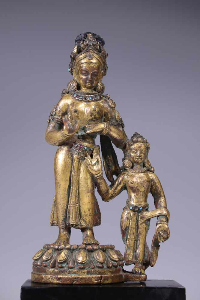 TARA WITH CONSORTbronze firegilt,Nepal, 12th century,Size: 17 cmTara with consort to her left side