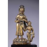 TARA WITH CONSORTbronze firegilt,Nepal, 12th century,Size: 17 cmTara with consort to her left side