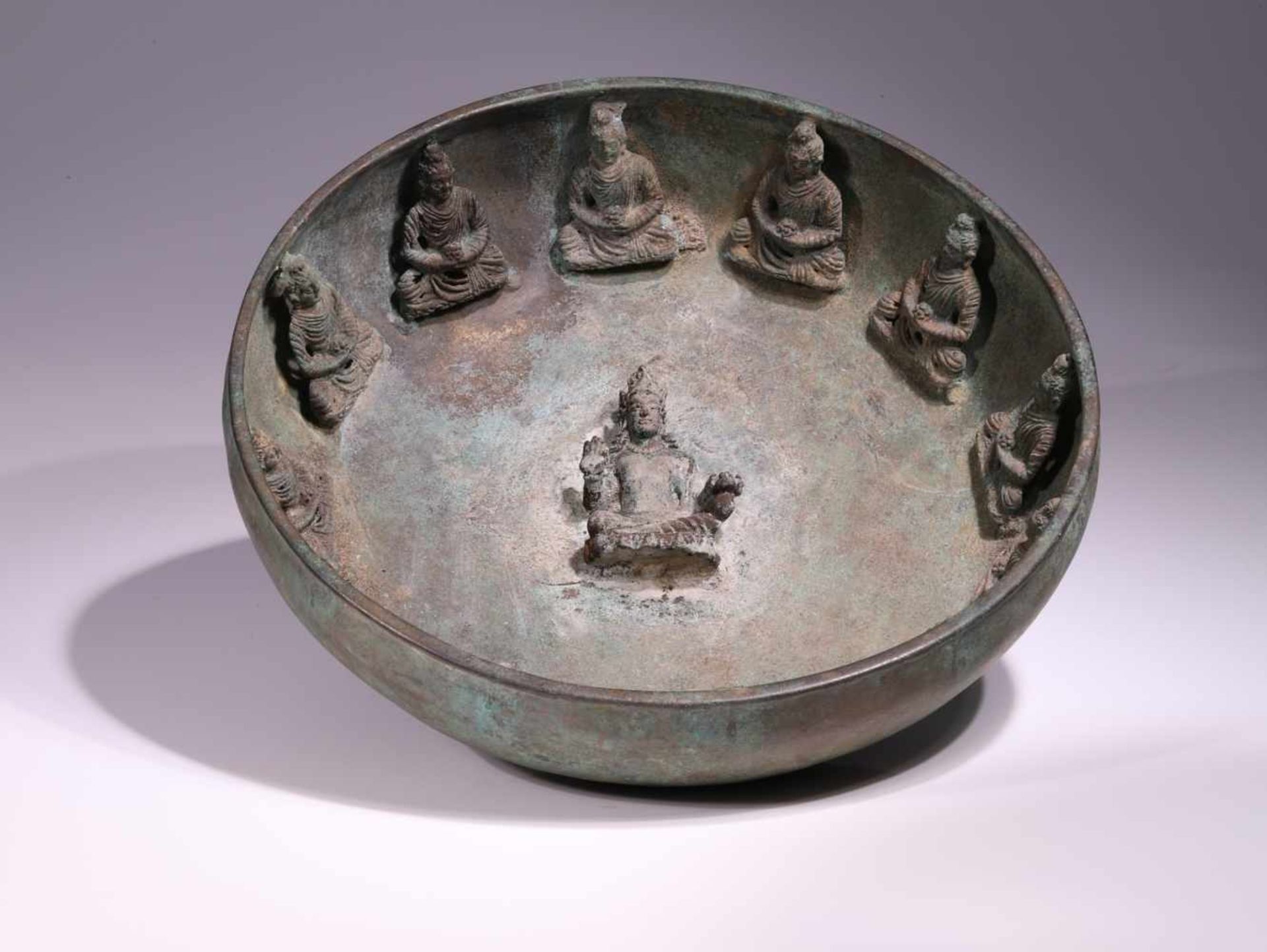 BOWL WITH BUDDHASBronze,Gandhara, 6th centuryDimensions: Height 8 cm / Wide27 cm / Depth 27