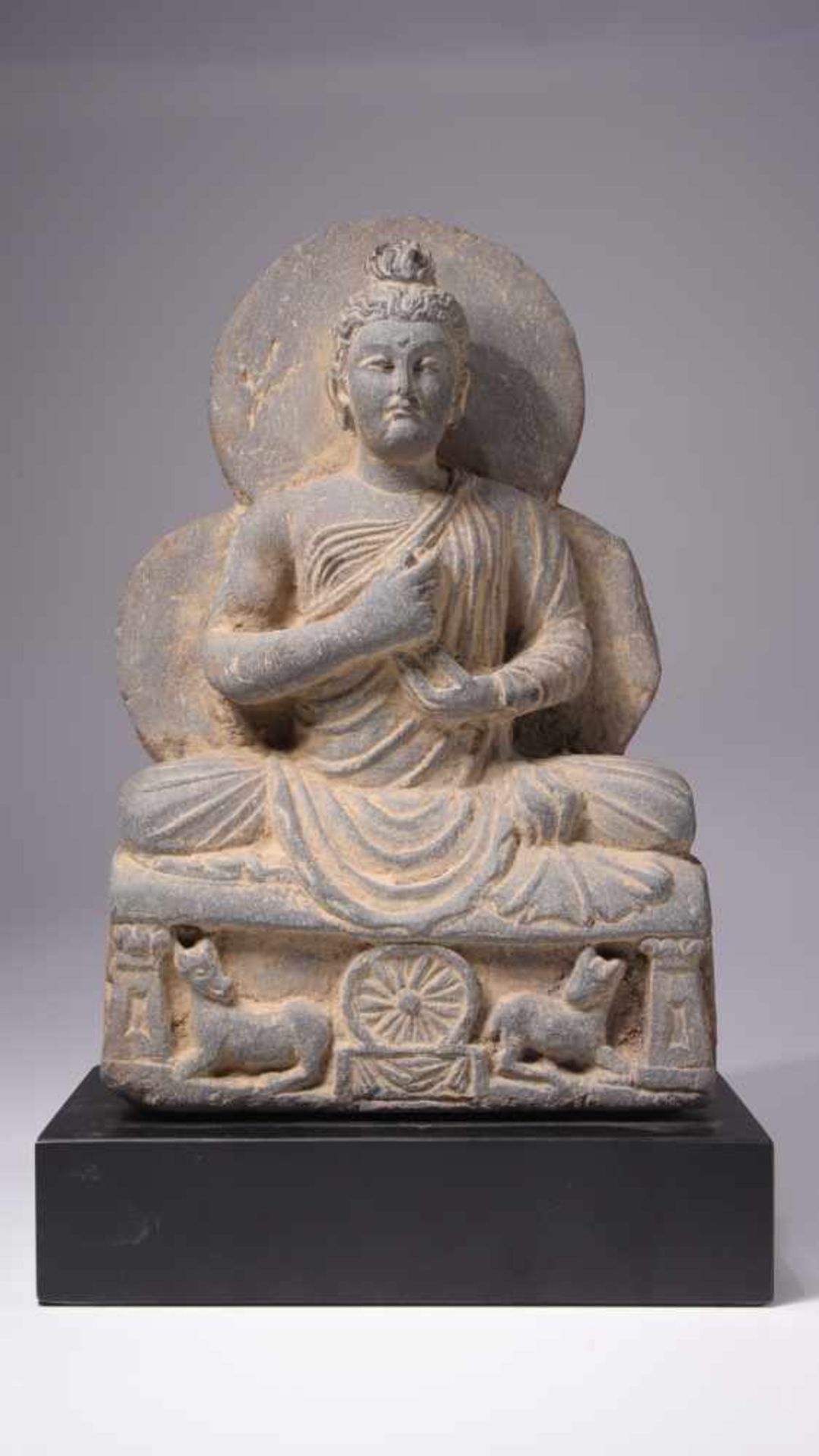 BUDDHAGrey SchistGandhara, 4th century B.C.Dimensions: Height 22 cm / Wide 15 cm / Depth 12