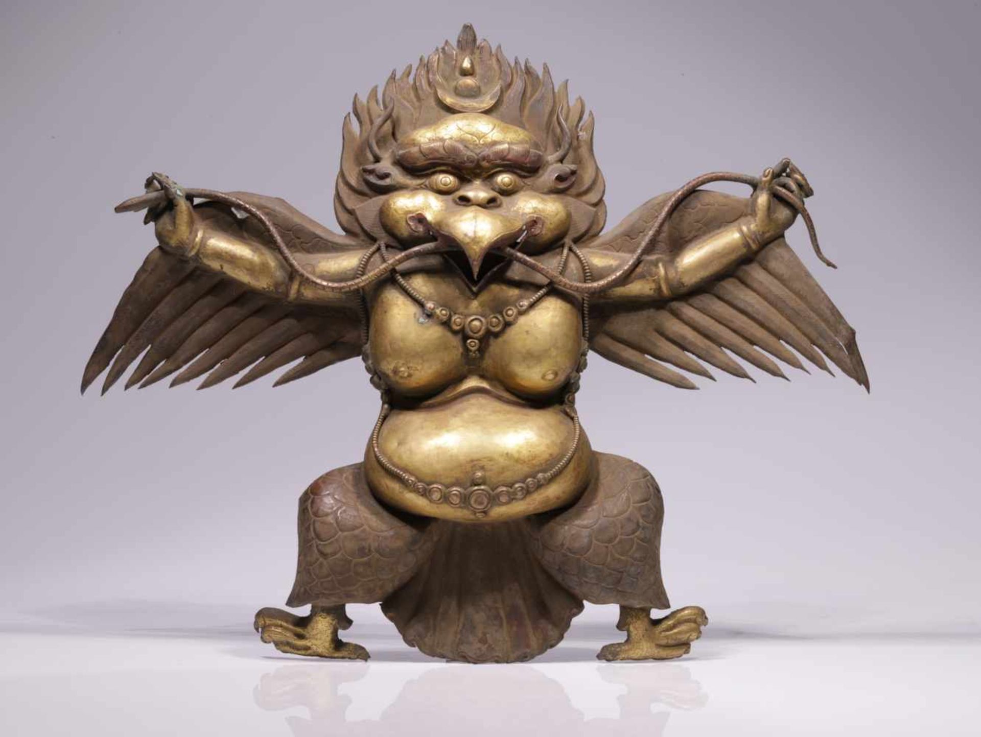 LARGE GARUDACopper repousse, firegilt,Nepal, 18th centuryDimensions: Height 40 cm / Wide 48 cm /