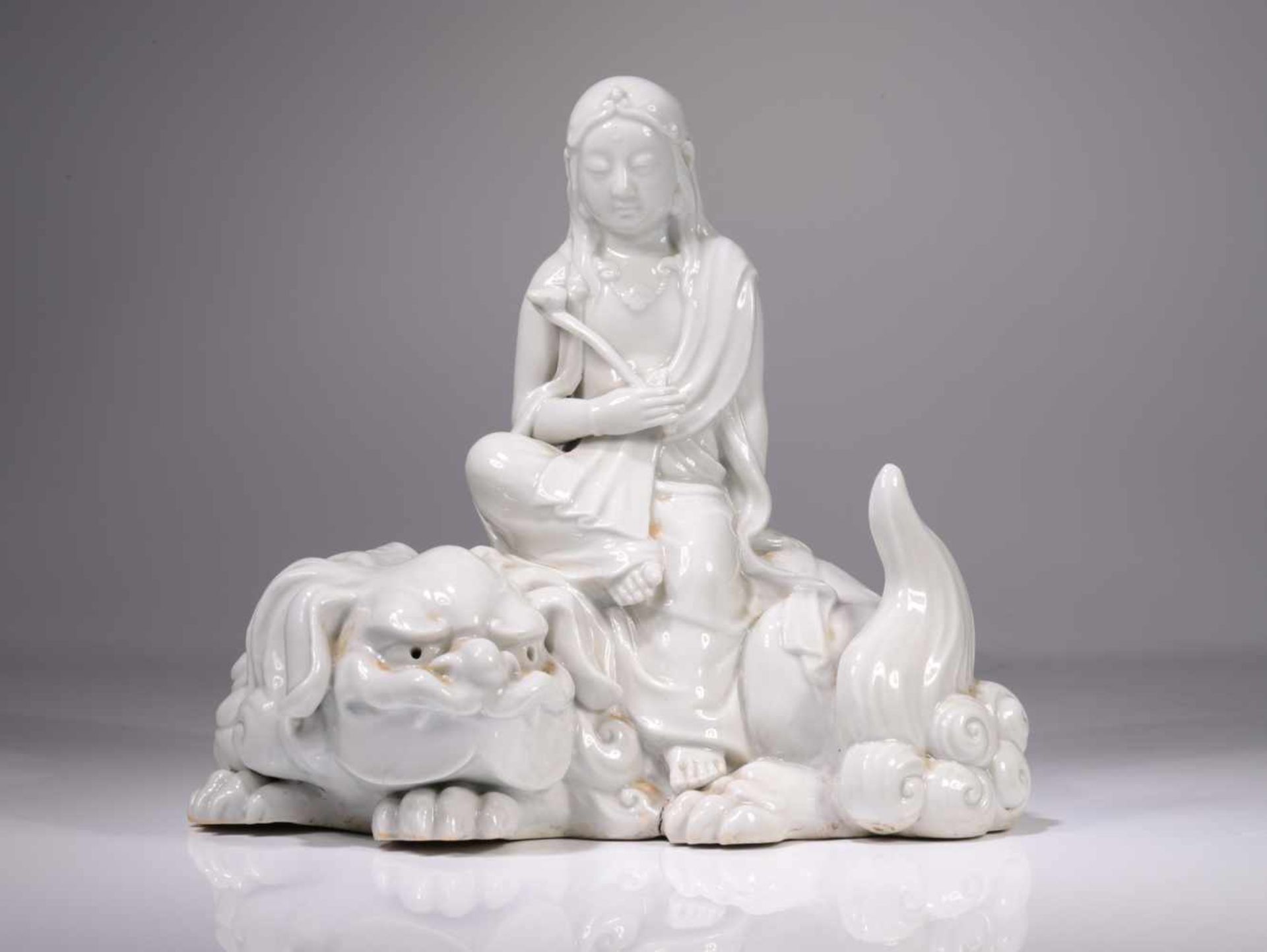 GUANYIN ON BUDDHIST LIONBlanc de chine,Japan or China, 19th centuryDimensions: Height 18 cm / Wide
