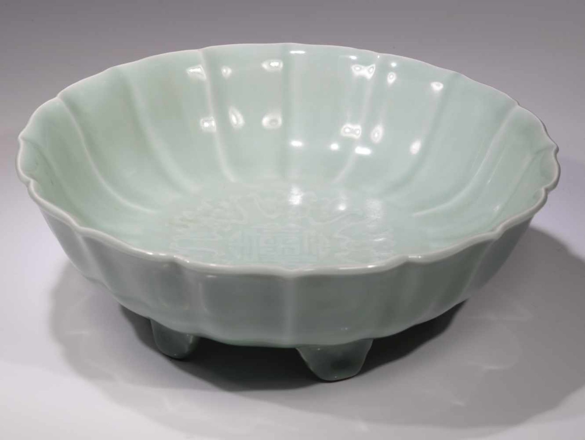 CELADON LOTUS BOWLPorcelain,China 19th centurySwastika in the center, 6 sign mark at the