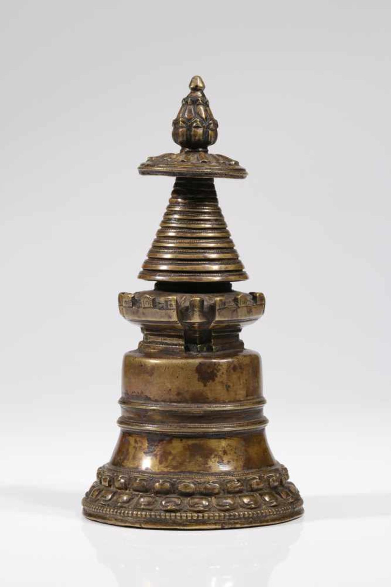 STUPABronze,Tibet, 16th centuryDimensions: Height 21 cm / Wide 10 cm / Depth 10 cmWeight: 818 gramsA