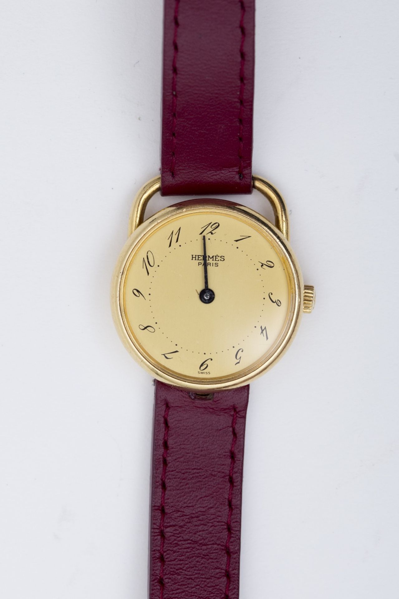 Hermès Lady's Arceau watch: 18 kt yellow gold, round dial, golden face, Arabic numerals, with double