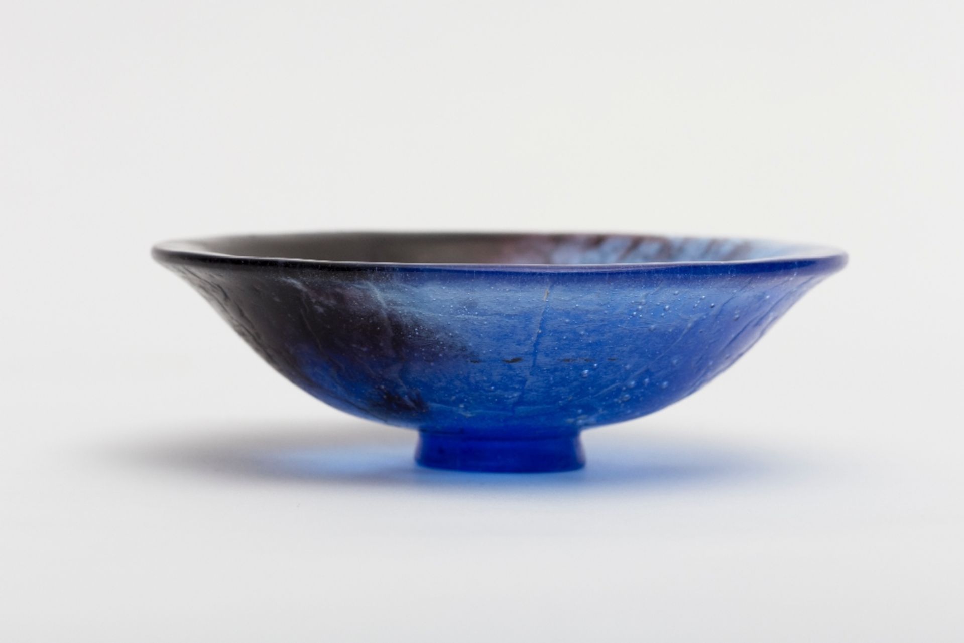 François Emile Decorchemont (1880-1971) Bowl; Speckled blue pâte de verre on a small base. Artist'