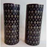 Pair of scroll vases; Ceramic with white and gold enamelled fleur de lys décor on a royal blue
