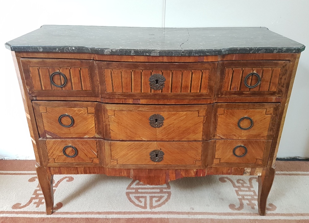 Transitional commode; Marquetry with three drawers and a grey marble surface. Numerous chips, marble