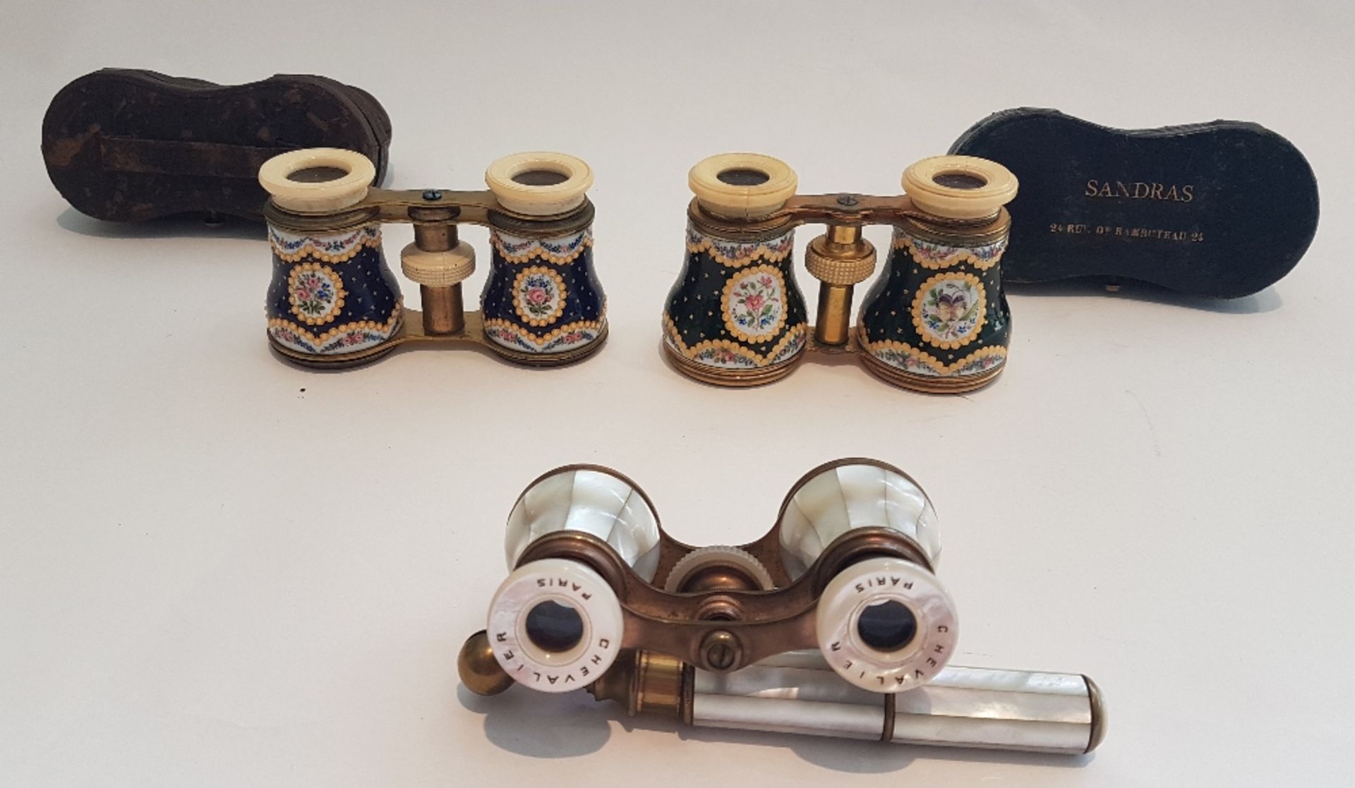 Set of three opera glasses; One signed "Chevalier Paris" in mother of pearl, the two others