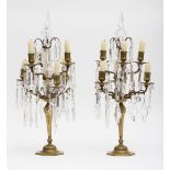 Pair of sconces; Bronze with golden patina, with 6 arms. Hole in the base for electric wiring. Glass