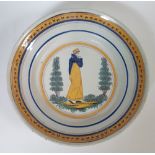 BrusselsWoman in a garden; Earthenware plate with polychrome décor on a white ground. Chipped D: