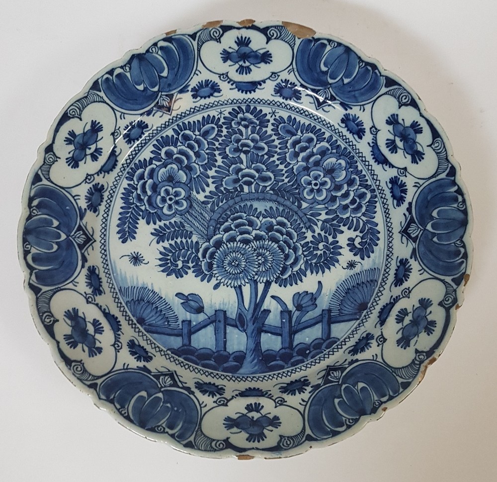 Delft, 18th centuryFlowering tree; Earthenware dish with blue décor on a white ground. Signed on the