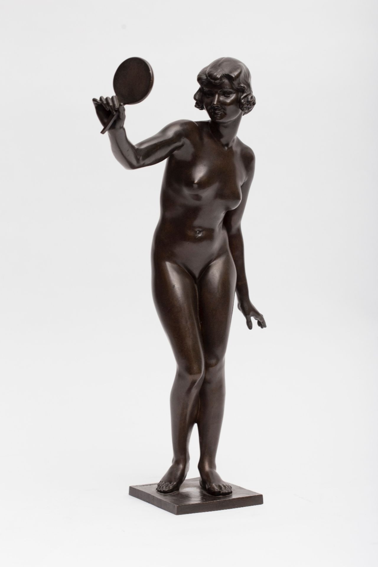 Jean Verschneider (1872-1943) Nude with a hand mirror; Bronze sculpture with black patina. Signed on