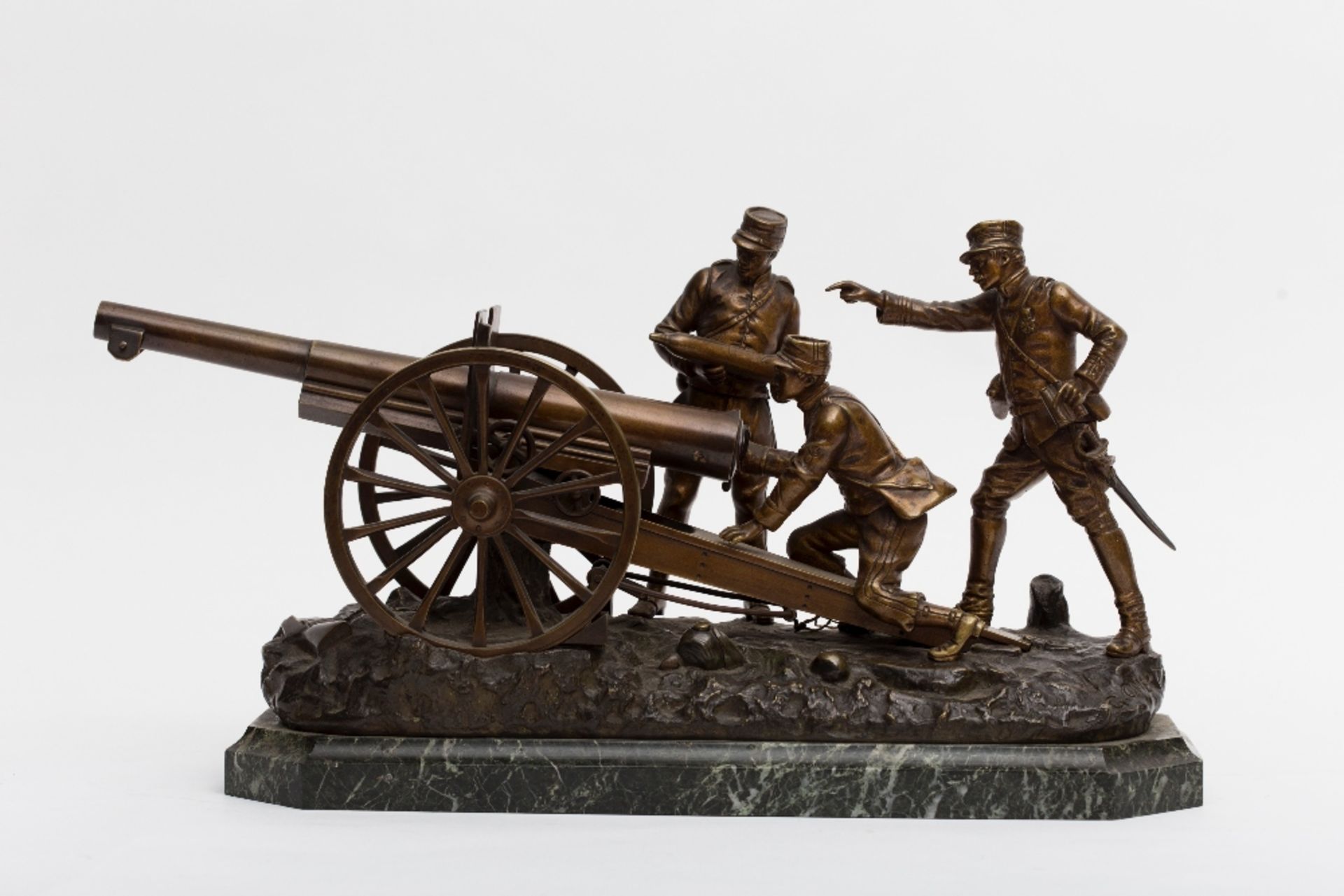 Georges Omerth (act.1895-1925) Loading the cannon; Bronze sculpture with golden-brown and dark brown