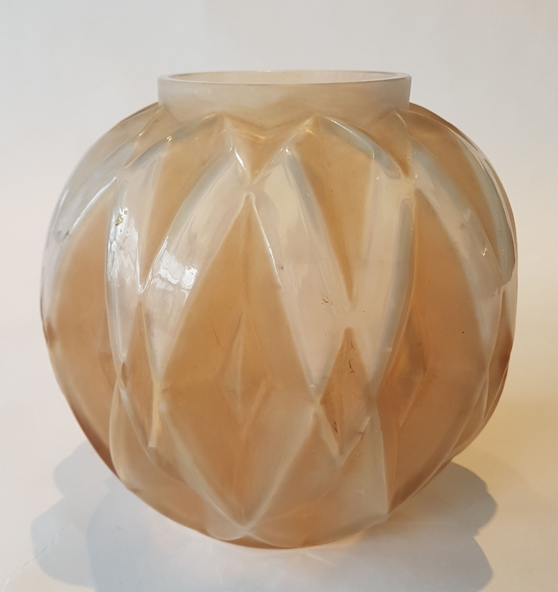 André Hunebelle (1896-1985)Prism; Moulded pressed pink satinised glass vase. Signed. H: 14.5 cm