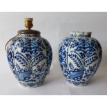 Delft, 18th centuryTwo vases; Earthenware decorated with blue flowers on a white ground. One has