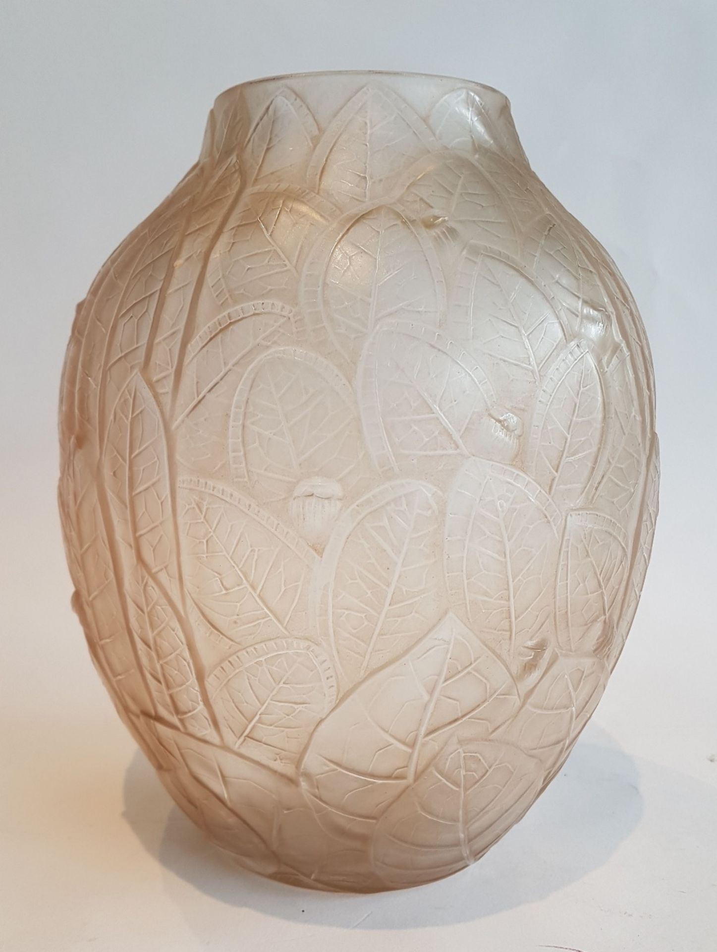 André Hunebelle (1896-1985)Acorns; Moulded pressed sepia satinised glass vase. Signed. H: 22 cm