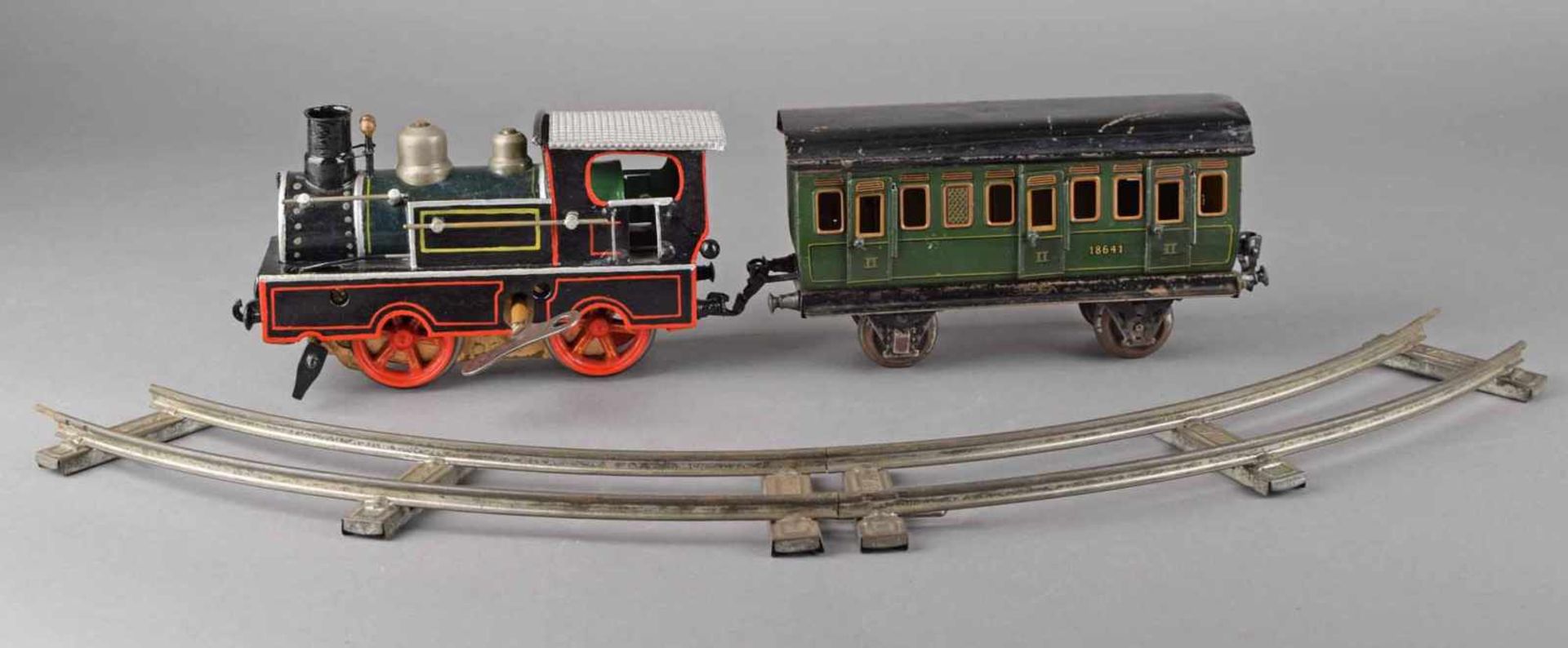 Lokomotive und Personenwagen Hersteller: Märklin, Spur I, Lokomotive mit Uhrwerk, ergänzt und - Bild 3 aus 4