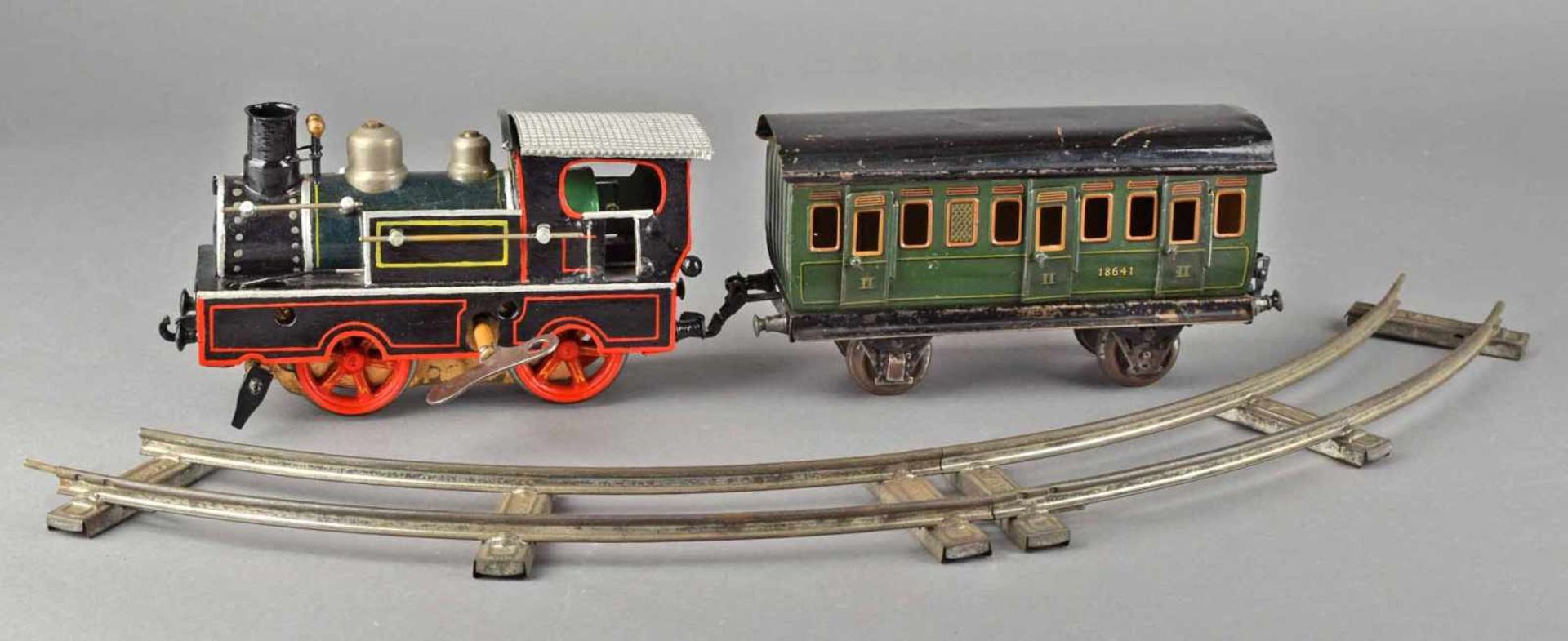 Lokomotive und Personenwagen Hersteller: Märklin, Spur I, Lokomotive mit Uhrwerk, ergänzt und - Bild 2 aus 4