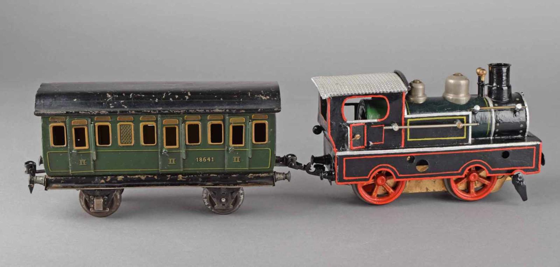 Lokomotive und Personenwagen Hersteller: Märklin, Spur I, Lokomotive mit Uhrwerk, ergänzt und - Bild 4 aus 4