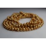 100 inch Strand of Gold Freshwater Pearl Necklace