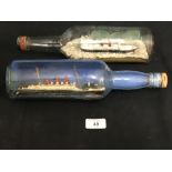 CUNARD: Naive scratch built ships in bottles showing Cunarders at sea - a pair. 12ins.