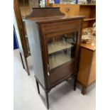19th cent. Mahogany music cabinet with glazed door. The whole on square tapering supports. 21ins.
