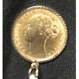 Coins: Victoria young head gold sovereign 1871 in 9ct. (tested) mount. Approx. 8.5gms in total.