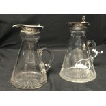 Hallmarked Silver: Whisky water pourers x 2, silver collars and covers, cut glass bases.
