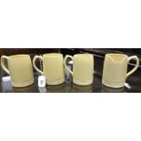 *A set of four 1930s Keith Murray for Wedgwood 'buttermilk' tankards. 1 A/F.